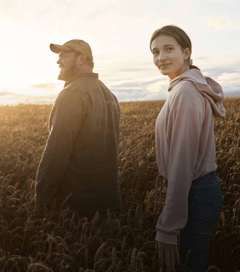 Farmer and daughter in the wheat field